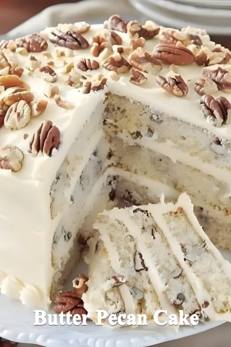 Delicious Butter Pecan Cake with creamy frosting and pecans on top