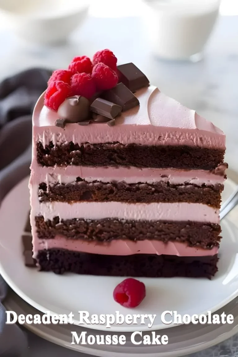 Decadent Raspberry Chocolate Mousse Cake topped with fresh raspberries