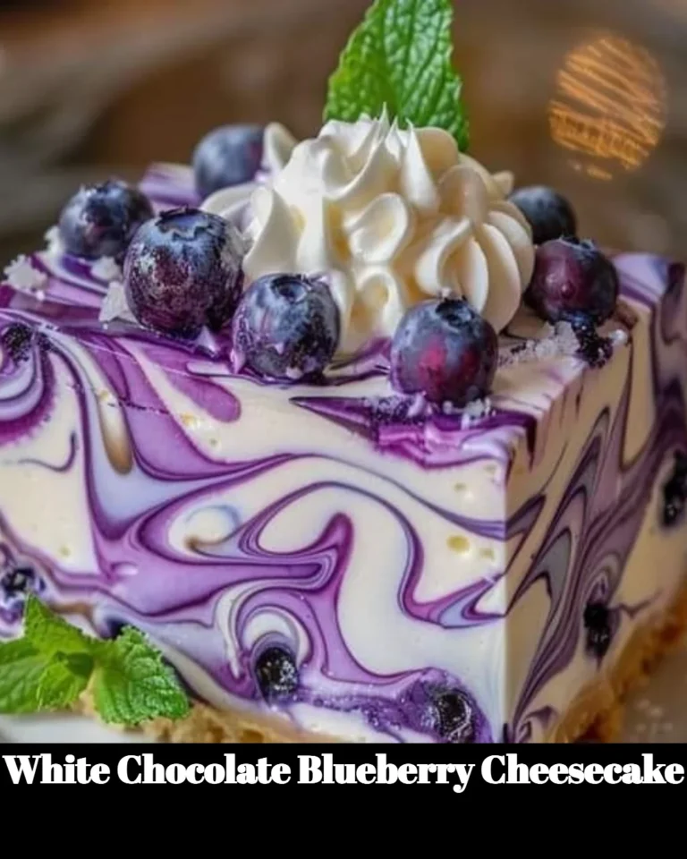 Slice of white chocolate blueberry cheesecake garnished with fresh blueberries