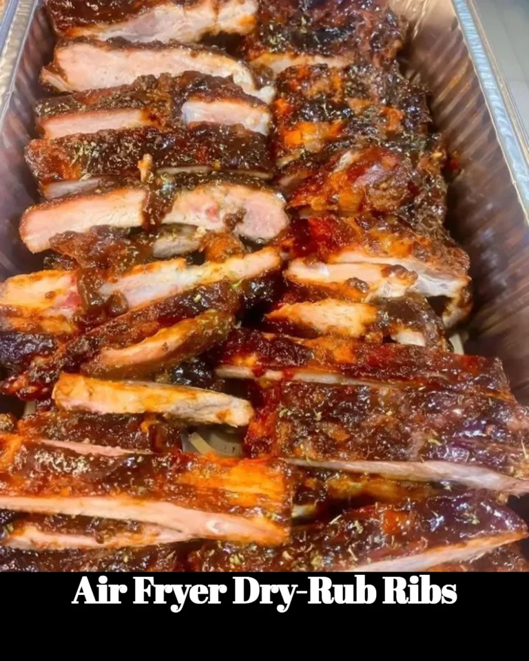 Plate of crispy air fryer dry-rub ribs garnished with herbs
