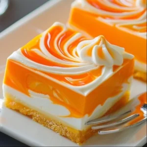 Delicious orange cheesecake bars with a creamy texture and citrus flavor.